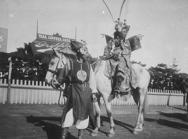 Black and white image of a man on horse in a Chinese procession at Sports Agricultural Grounds 1897