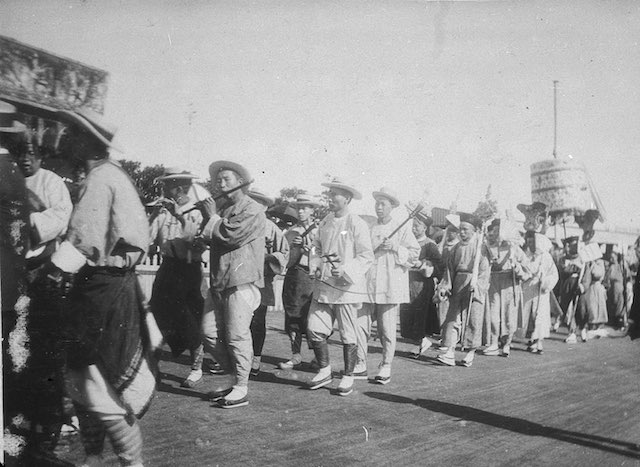 Black and white image of a Chinese procession at Sports Agricultural Grounds 1897