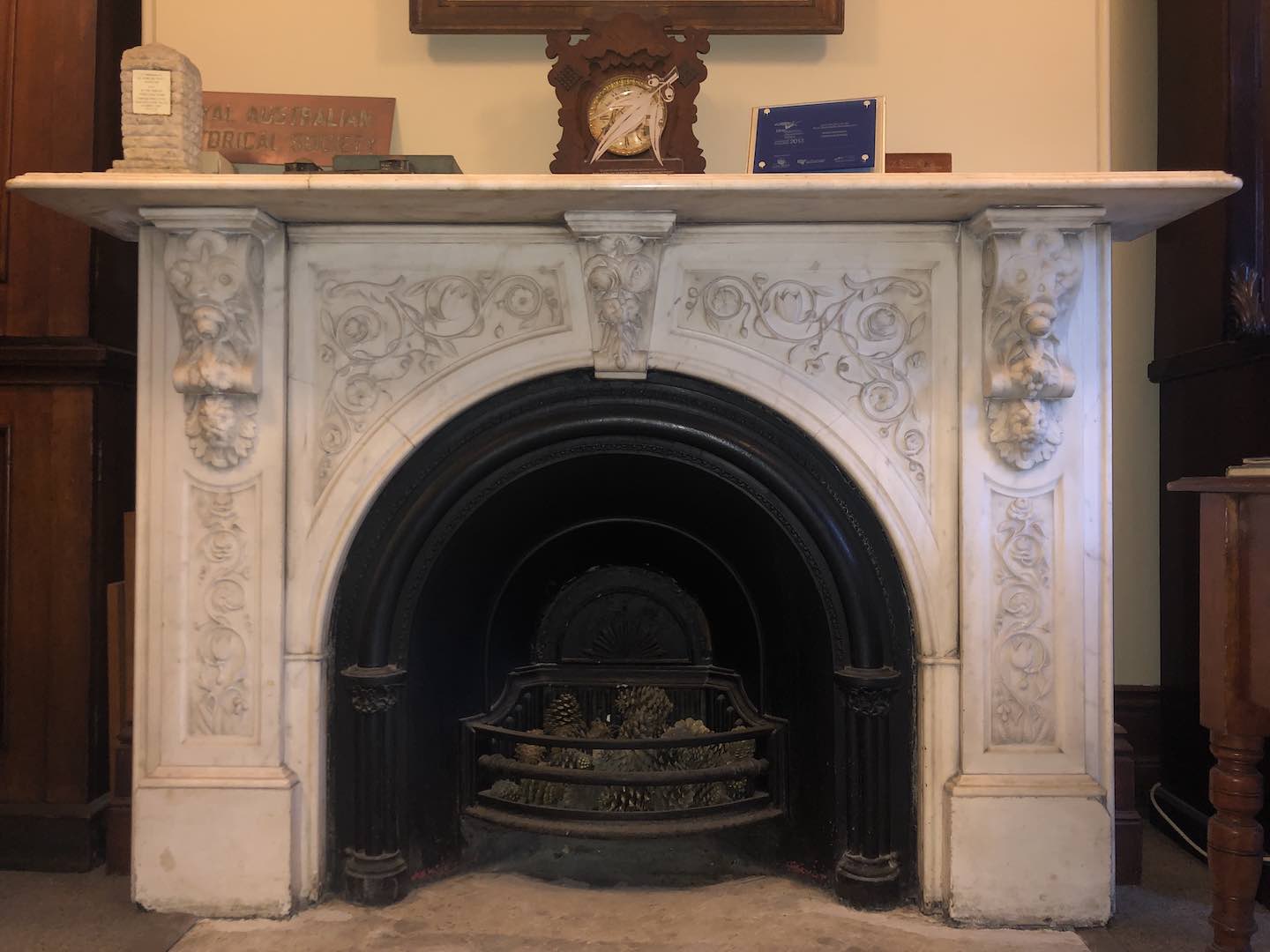 History House white marble fireplace, decorated in an elaborate design.