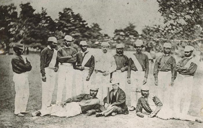 A black and white photograph of a group of twelve men in the 1868 Test Team in England.