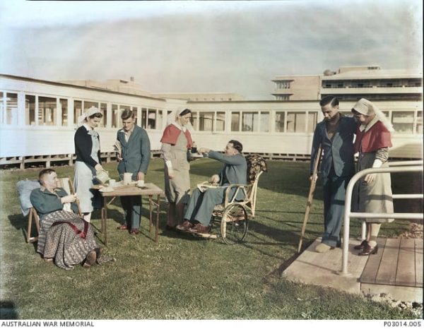 Soldiers convalescing at the Heidelberg Repatriation Hospital. They are being assisted by nursing staff