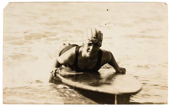 Photograph taken of Isabel Letham on her surfboard at South Steyne in 1917.