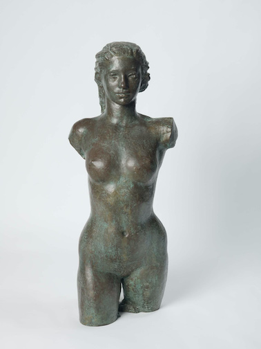 Daphne turned to portrait sculpting, featured in this photograph is the Olympian, a half – body female sculpture carved in 1946 and cast in bronze after 1958, is one of her more famous works from this period.