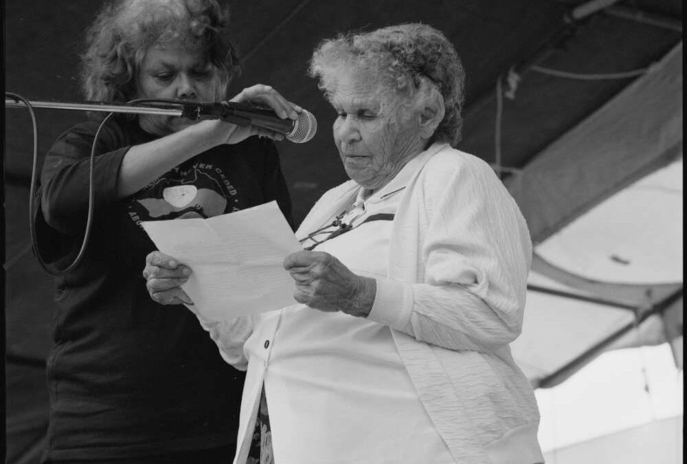 Photograph of Mum Shirl (Mrs Shirley Smith) speaking at the Australia Day ceremony at the Aboriginal Tent Embassy in front of Old Parliament, Canberra, 26th January 1998.