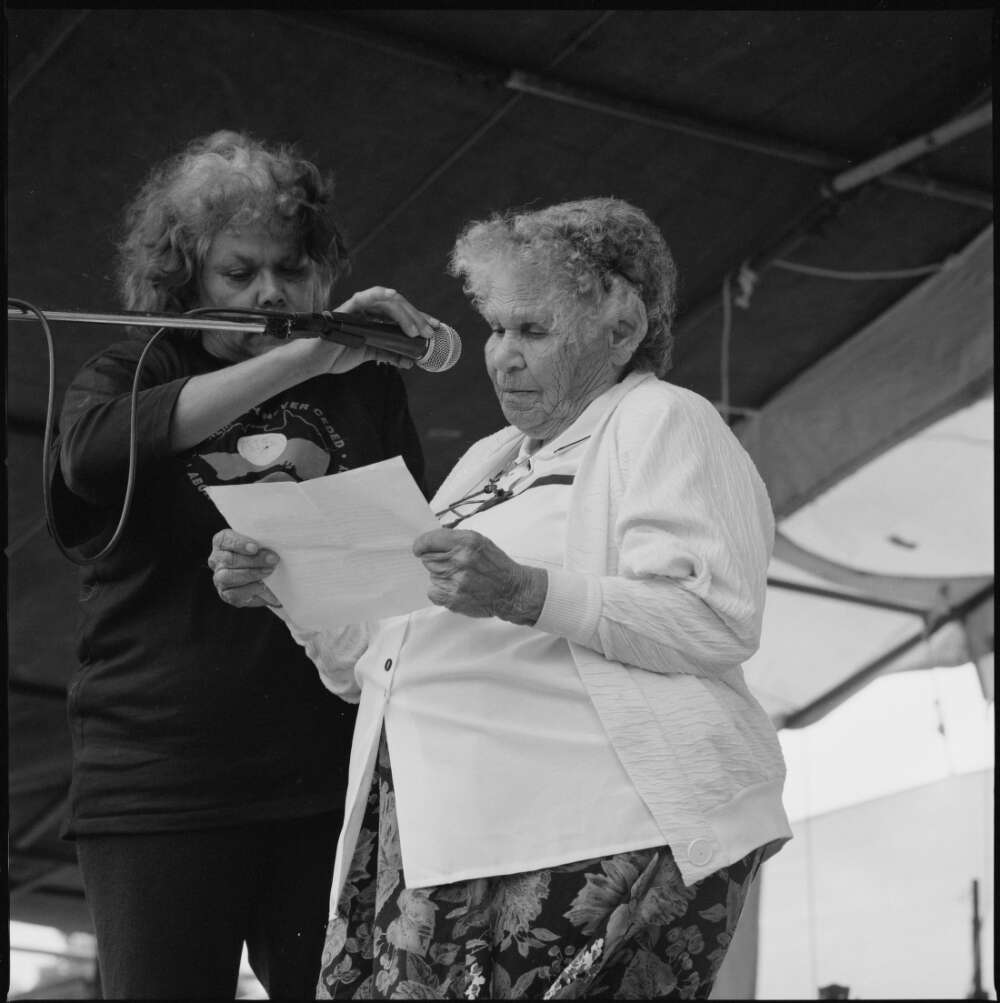 Photograph of Mum Shirl (Mrs Shirley Smith) speaking at the Australia Day ceremony at the Aboriginal Tent Embassy in front of Old Parliament, Canberra, 26th January 1998.