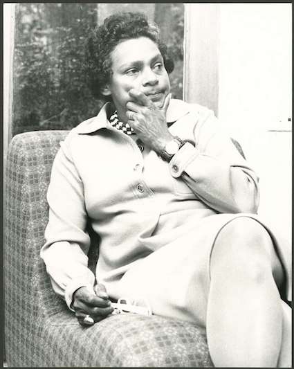 Photograph of Faith Bandler sitting in a chair on her father’s island home “Ambrym” in 1975 being interviewed by Robin Hughes.