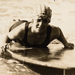 Photograph taken of Isabel Letham on her surfboard at South Steyne in 1917.