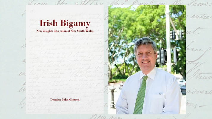 A photograph of Damian Gleeson beside a book titled, 'Irish Bigamy: New insights into colonial NSW'.