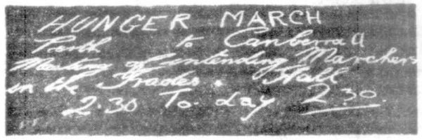 Photograph of chalk writing on pavement taken from the Mirror newspaper in Perth in 1930. The text reads: 'HUNGER MARCH. Perth to Canberra. 2.30 Today.'