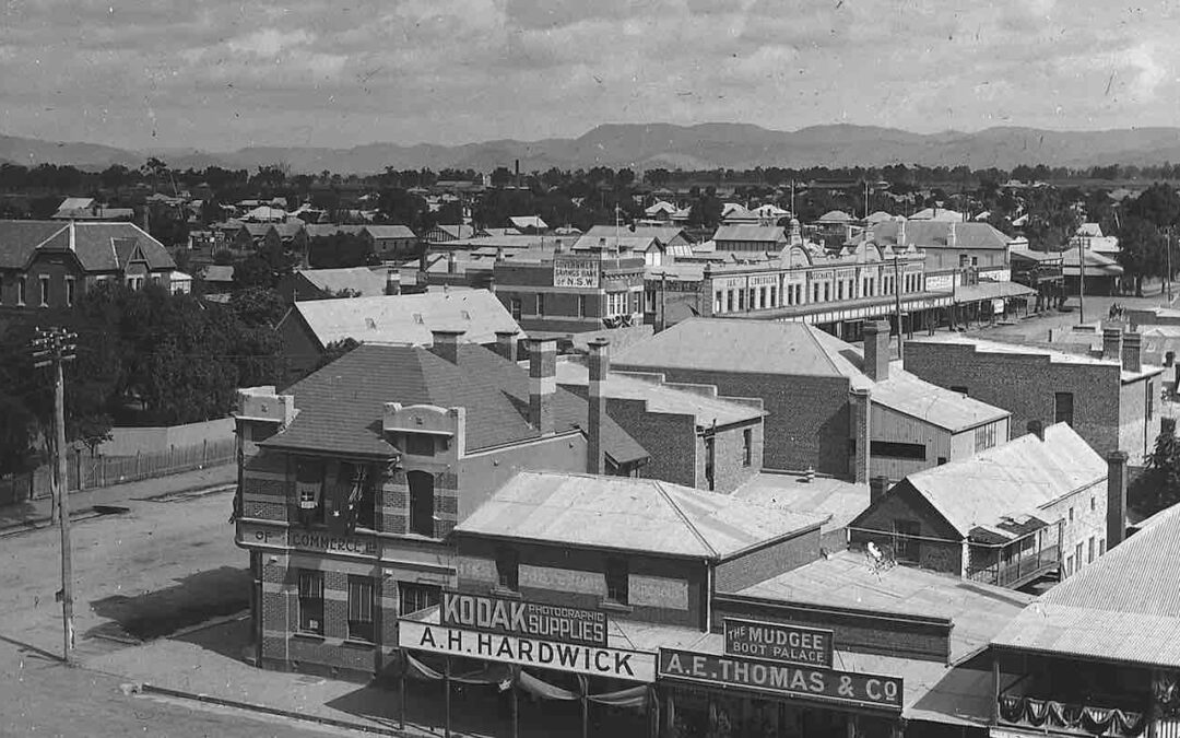 A photograph of the Mudgee township, in the foreground is visible Kodak Supplies and A.H. Hardwick.