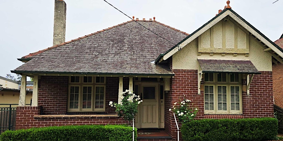 A red-brick Federation-style home.