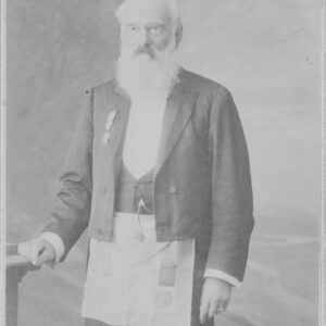 A portrait-style photograph of William Waterhouse, wearing a black suit with a Freemason apron.