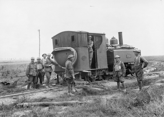 Australian soldiers pose with an English light railway engine, no. 796