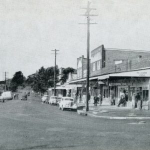 Photograph of Railway Avenue in Bundanoon. The road is unpaved, and the Soldiers Memorial Hall is visible.