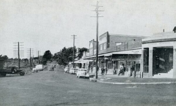 Photograph of Railway Avenue in Bundanoon. The road is unpaved, and the Soldiers Memorial Hall is visible.