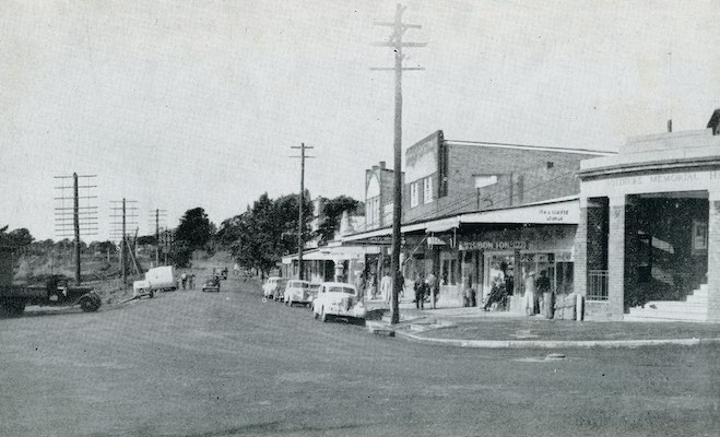 Photograph of Railway Avenue in Bundanoon. The road is unpaved, and the Soldiers Memorial Hall is visible.
