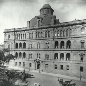 A glass negative showing the sandstone Lands Department Building on Bridge Street in Sydney.